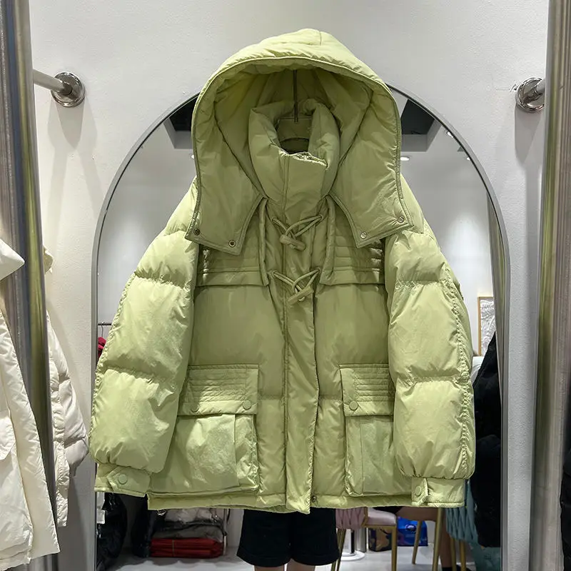 2023 Yeni Kış Kalınlaşmış Gevşek uzun kaban kadın Giyim Kış Kore Kapşonlu Cowhorn Düğme Büyük Boy Cep Ceketler AC849
